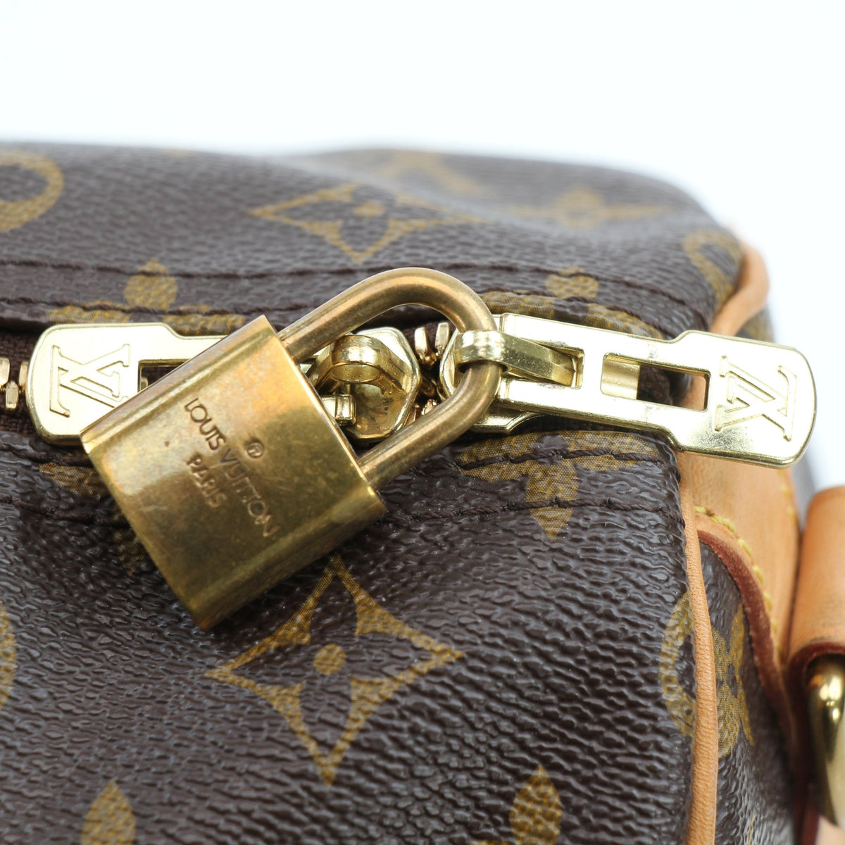 Louis Vuitton Speedy Bandoulière 30 handbag with gold hardware, featuring classic monogram canvas and leather accents.