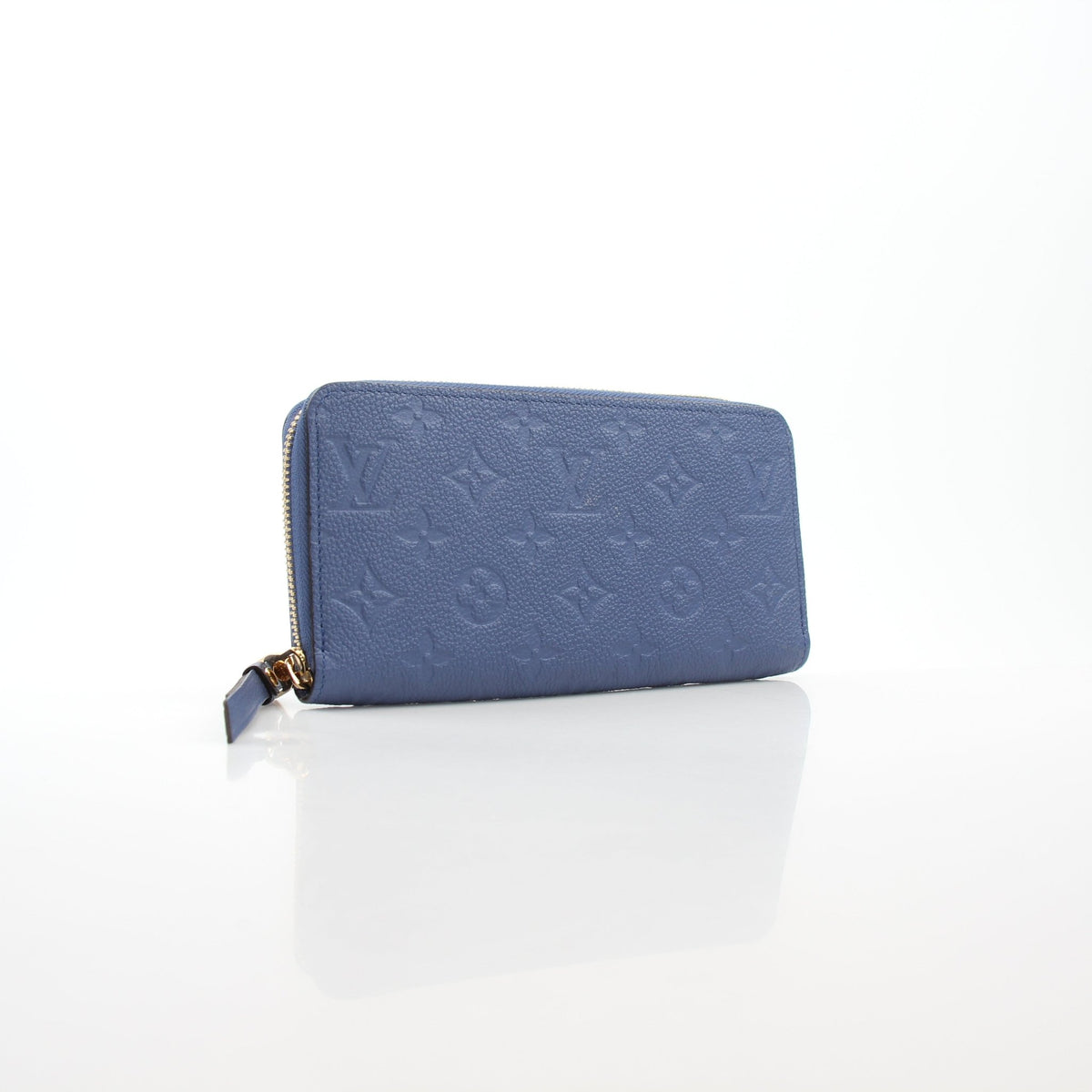 Louis Vuitton Monogram Empreinte Zippy Wallet in Bleu Infini with gold accents, featuring multiple card slots and a zippered coin compartment.
