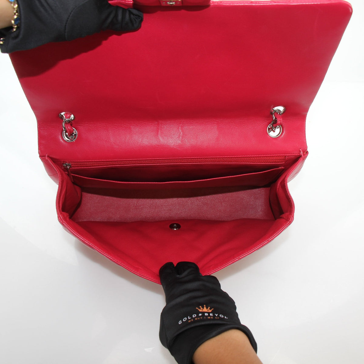 Red Chanel Classic Maxi Double Flap Lambskin Shoulder Bag with gold hardware, featuring signature quilted design and chain strap.