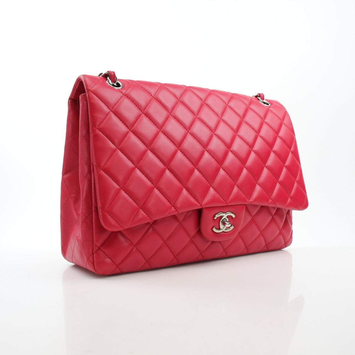 Chanel Classic Maxi Double Flap red lambskin shoulder handbag with gold hardware, featuring signature quilting and chain strap.