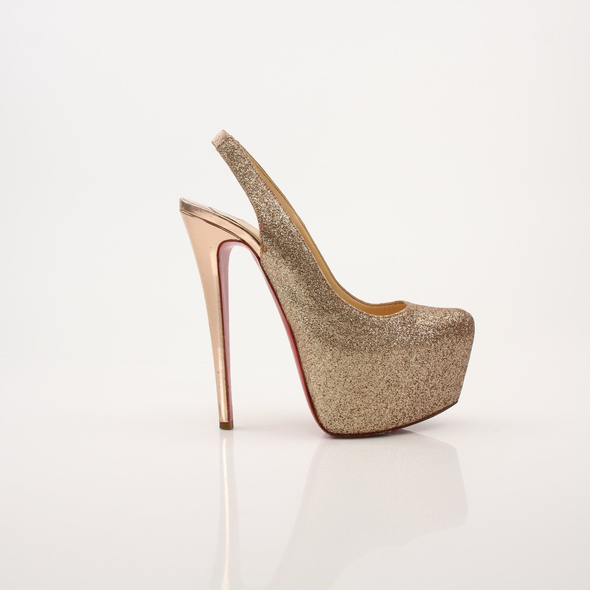 Christian Louboutin Daffodil Sling Heels in vibrant yellow with signature red sole, stylish high-heeled footwear from Gold & Beyond.