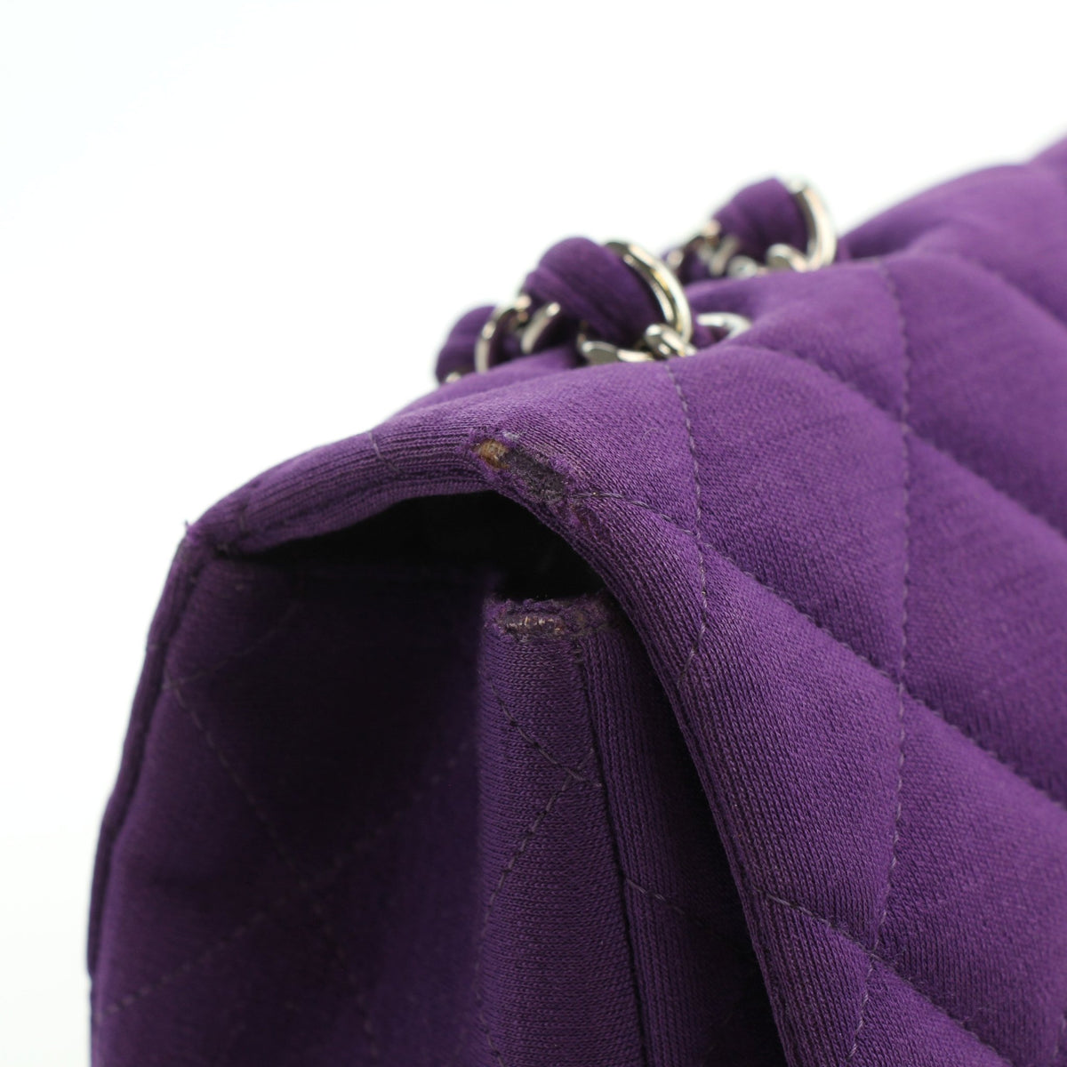 Purple quilted Chanel Classic Jumbo flap shoulder handbag with gold hardware and signature quilting design.