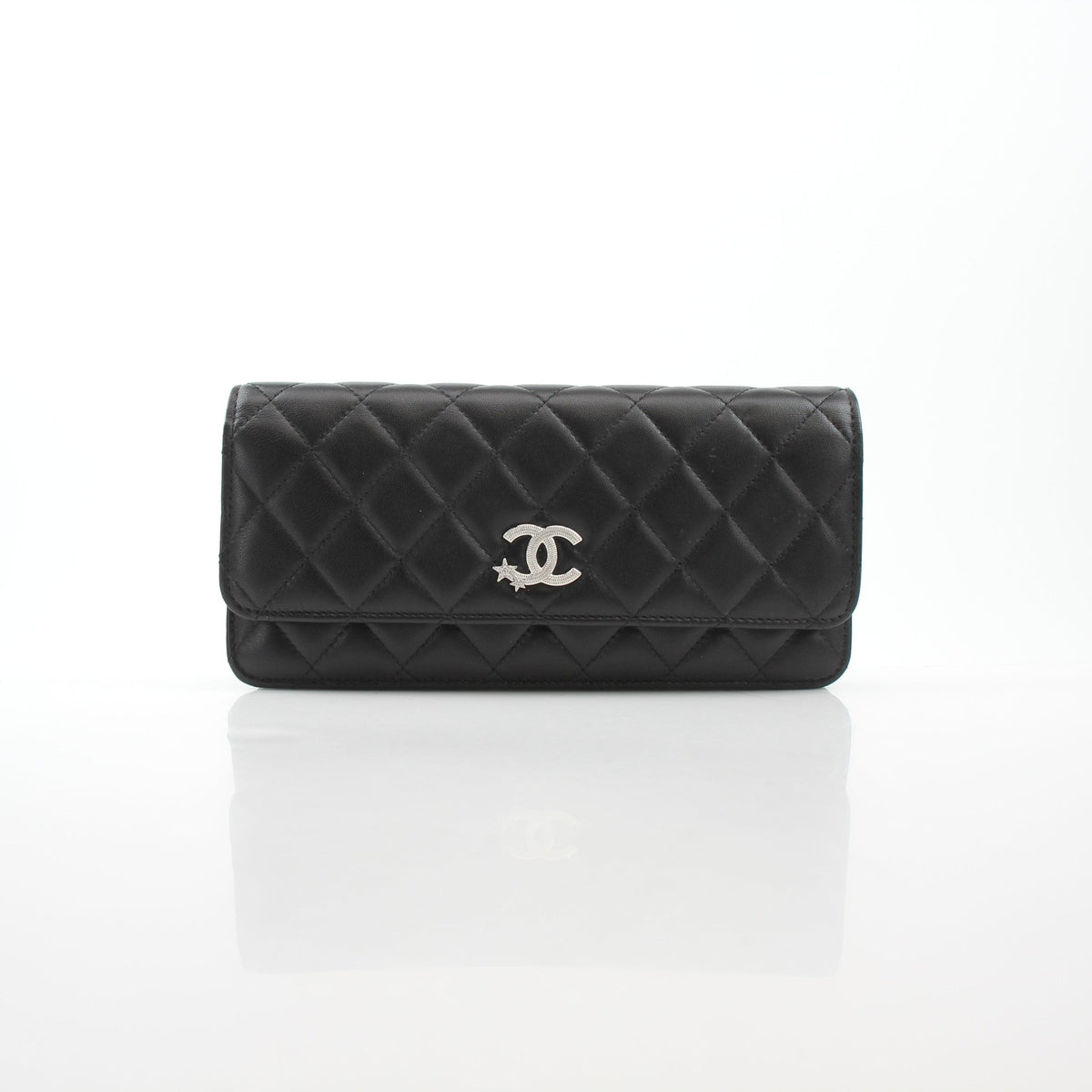 Black quilted Chanel Crystal Star Wallet on Chain handbag with gold hardware and crystal embellishments, crafted from luxurious lambskin leather.