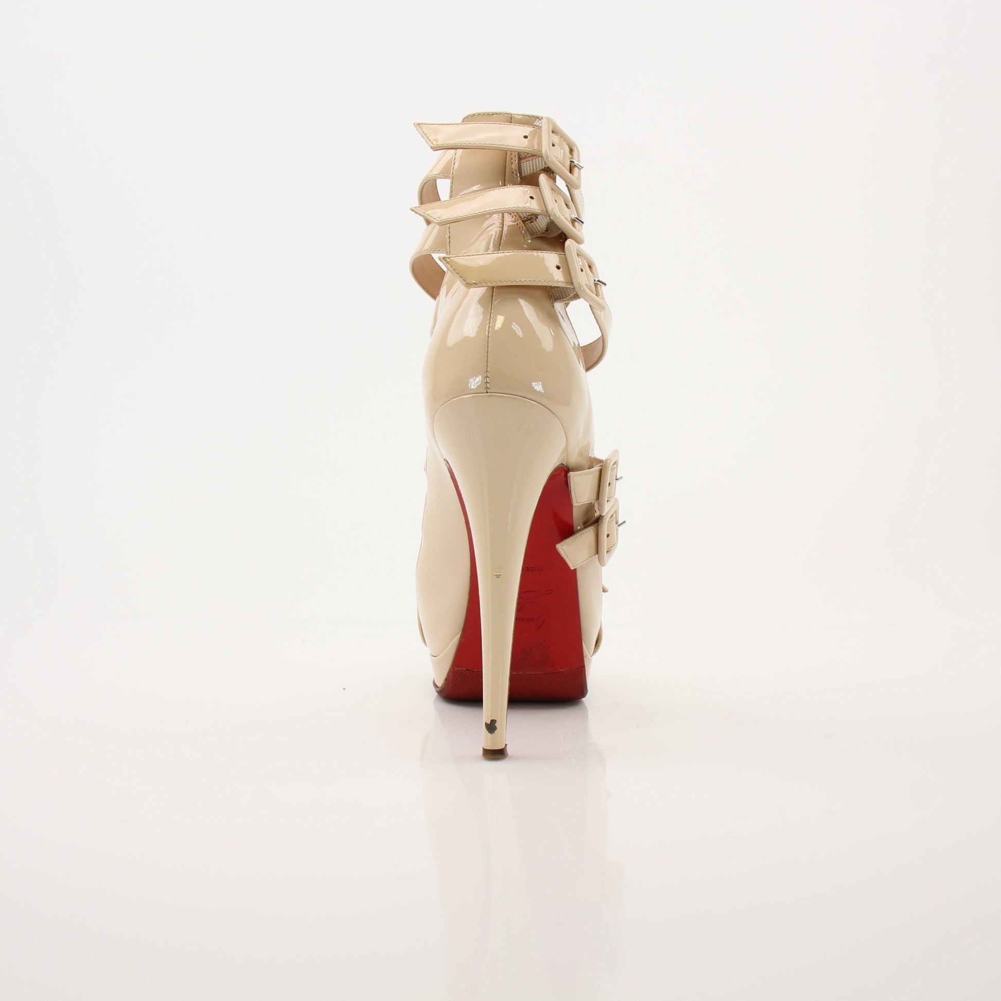 Christian Louboutin Differa 140 heels in black with red sole, featuring pointed toe and stiletto heel, on a neutral background.