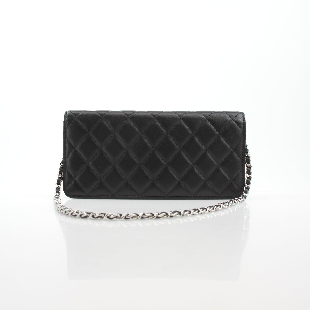 Black quilted lambskin Chanel Crystal Star Wallet on Chain handbag with gold-tone chain and crystal embellishments.