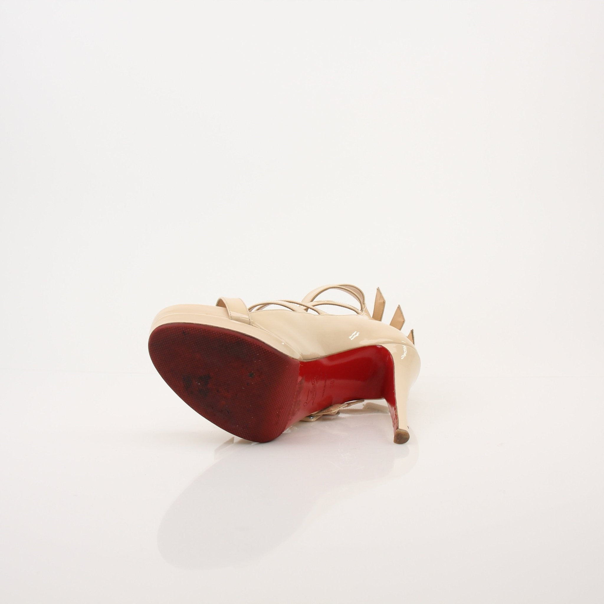 Christian Louboutin Differa 140 heels by Gold & Beyond, showcasing elegant black stiletto shoes with signature red soles.