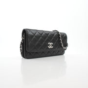 Black Chanel Crystal Star Wallet on Chain handbag with quilted lambskin and gold hardware, featuring crystal embellishments.