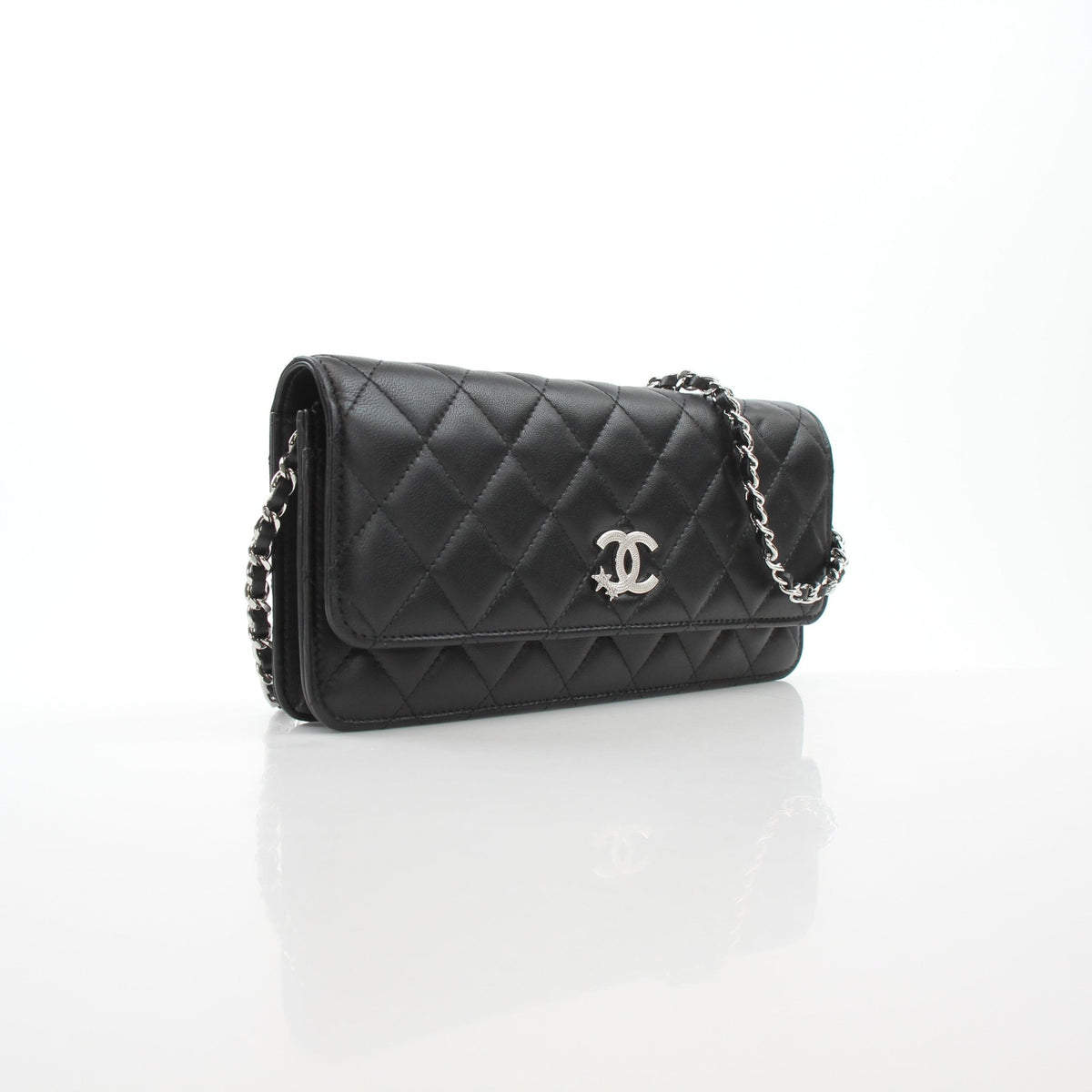 Black Chanel Crystal Star Wallet on Chain handbag with quilted lambskin and gold hardware, featuring crystal embellishments.