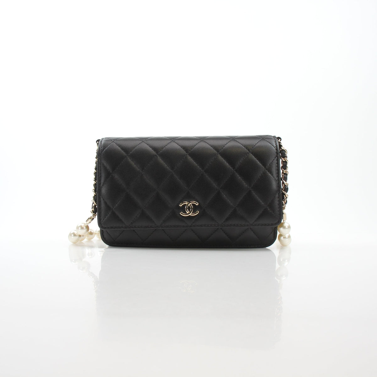 Chanel Pearly Chain Classic Wallet on Chain in black lambskin, featuring a pearl chain strap and compact design