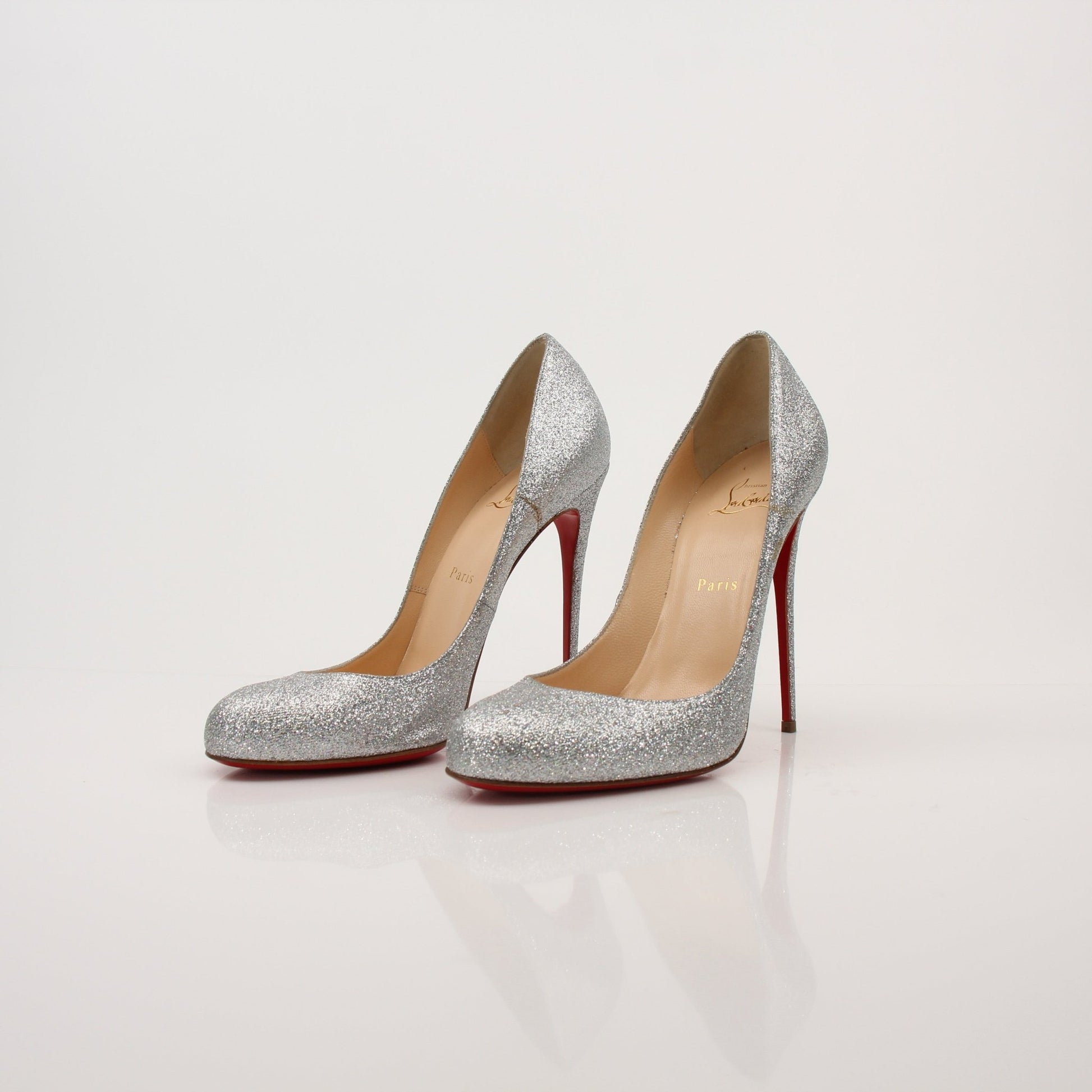 Christian Louboutin Fifille pump heels with red sole and elegant design, displayed on a neutral background.