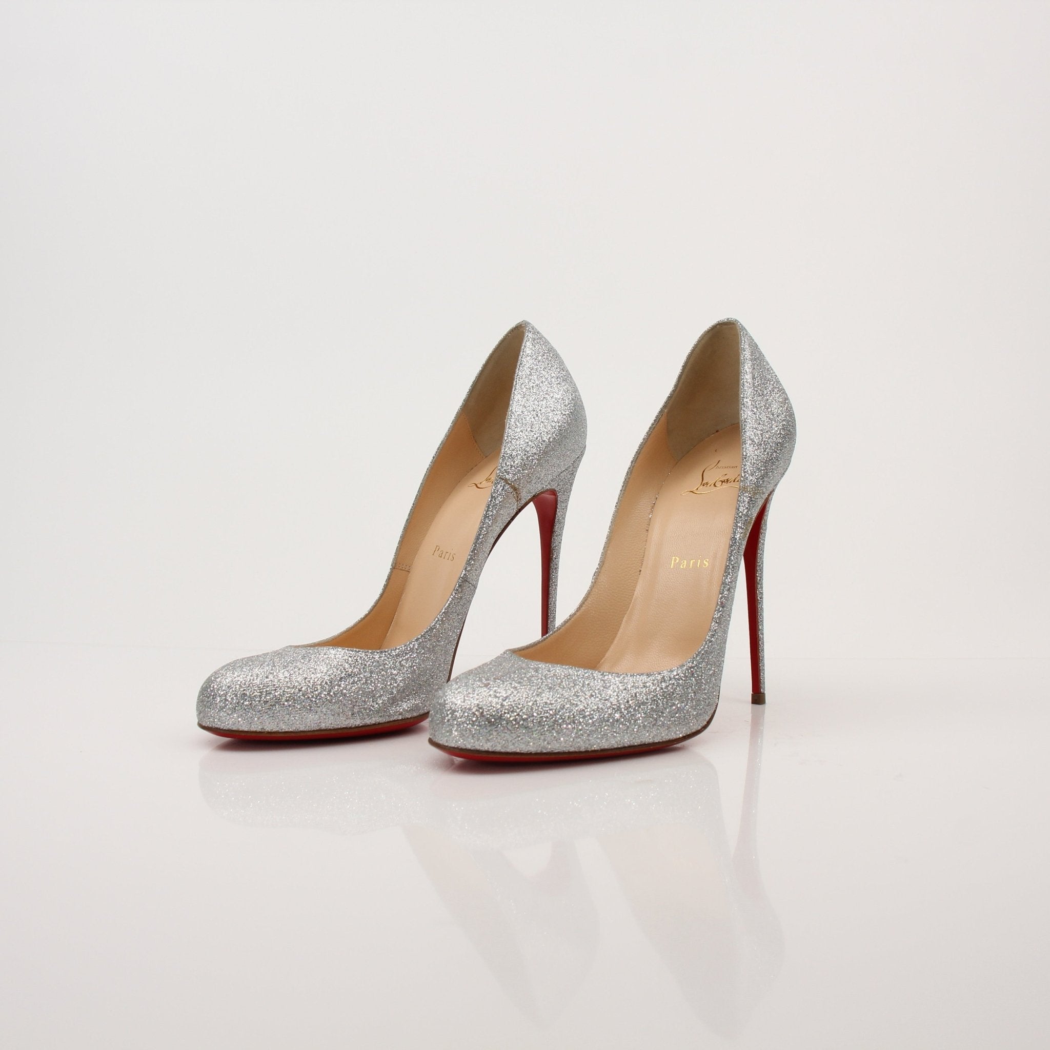 Christian Louboutin Fifille pump heels with red sole and elegant design, displayed on a neutral background.