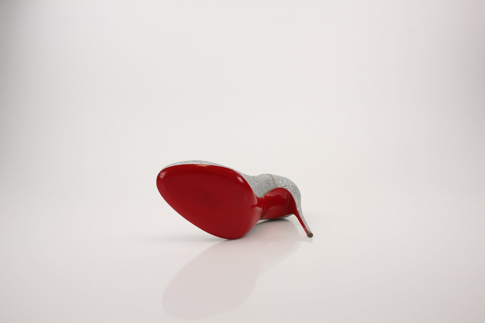 Christian Louboutin Fifille pump heels with red sole and glossy finish, stylish high-heeled footwear for women.