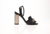 Black satin Burberry Coleford heels with gold chain detail, size 36, by Gold & Beyond, featuring elegant ankle strap and pointed toe