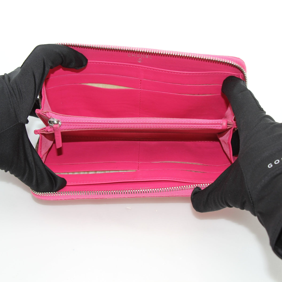 Pink Chanel zip-around long wallet by Gold & Beyond, exterior view with full-length zipper closure