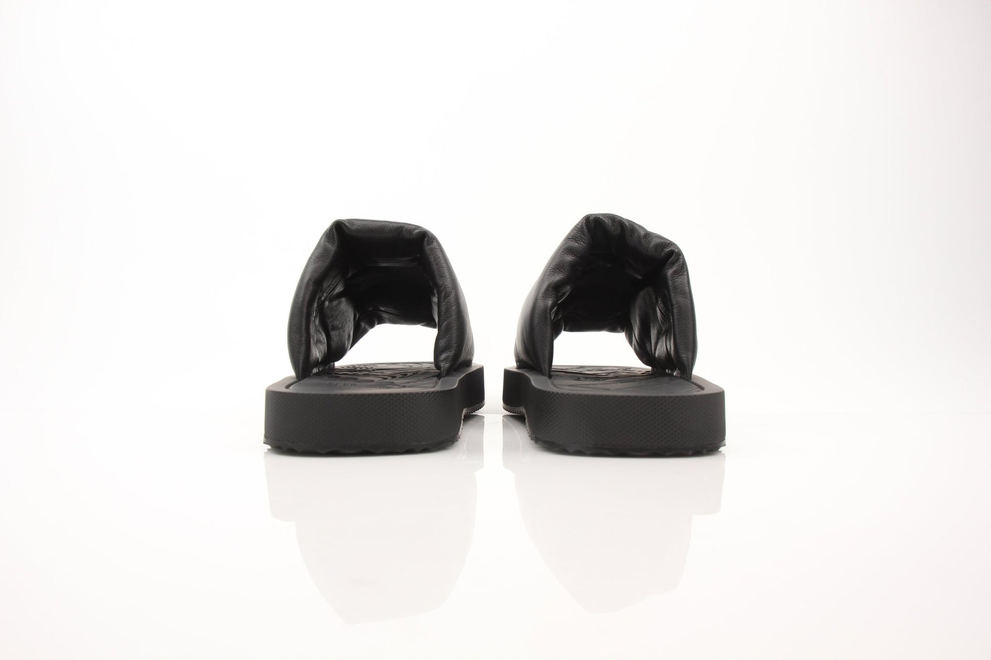 Gold & Beyond black leather sandals featuring Burberry Knight Slab design, size 12, with sleek strap details and sturdy sole.