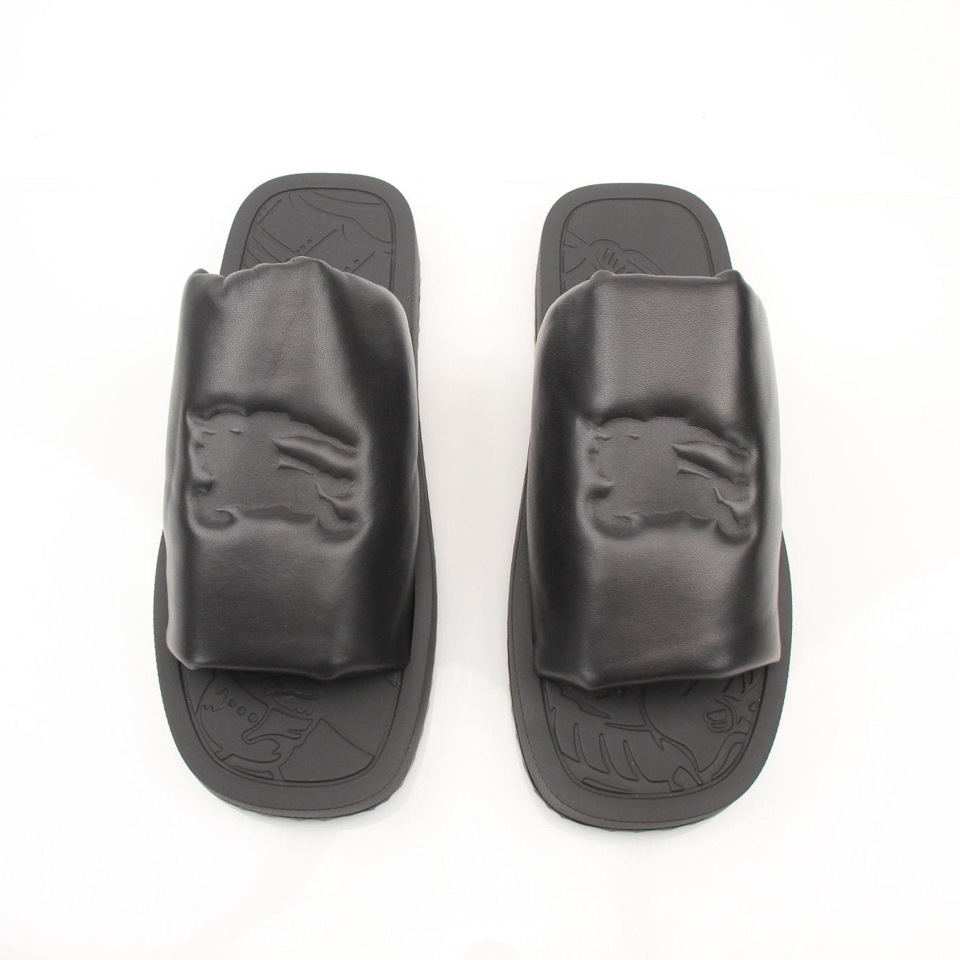 Gold & Beyond Burberry Knight Slab Black Sandals, stylish open-toe shoes with a sleek black design and textured sole.