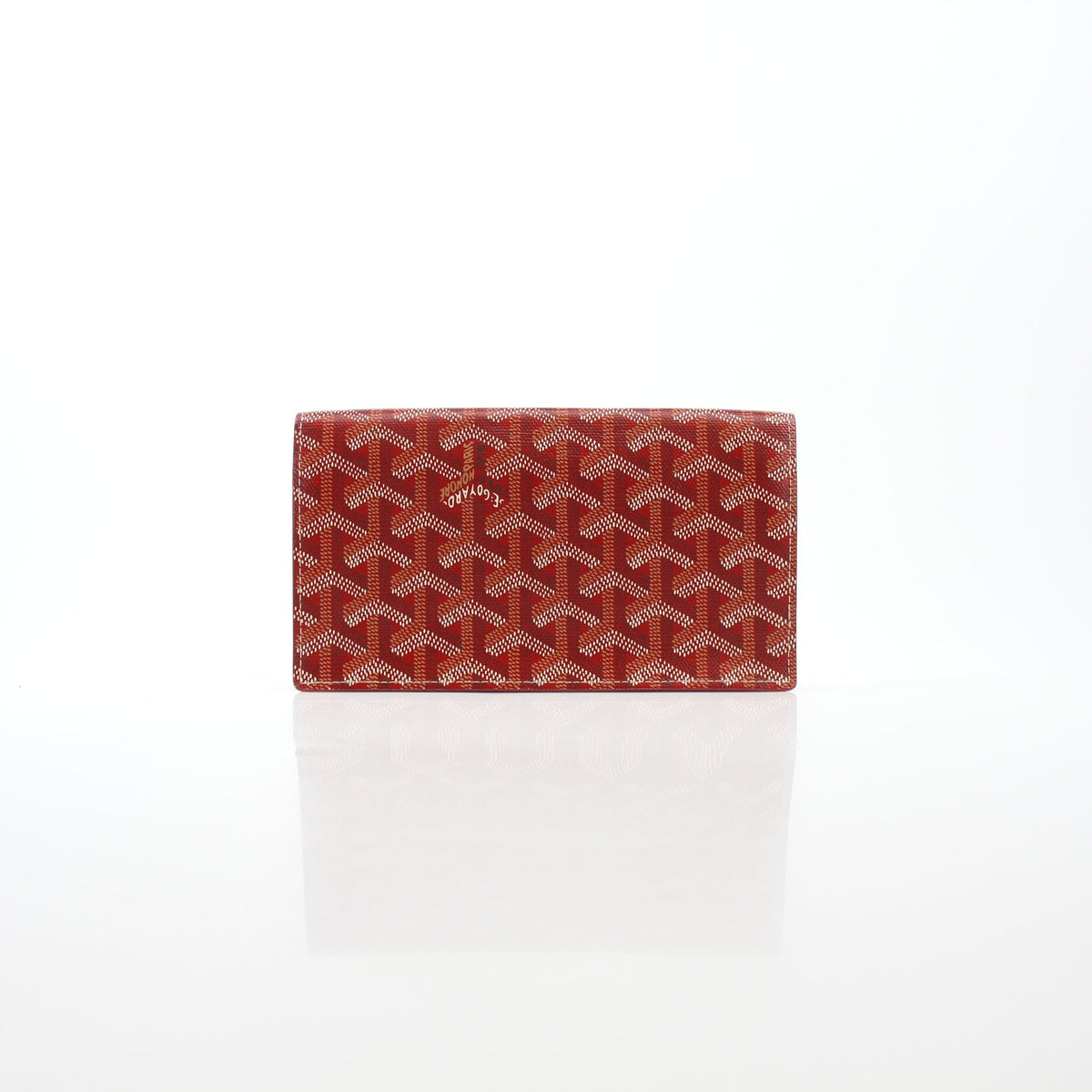 Goyard Varenne long flap wallet in red with gold logo, featuring multiple card slots and a sleek leather design.
