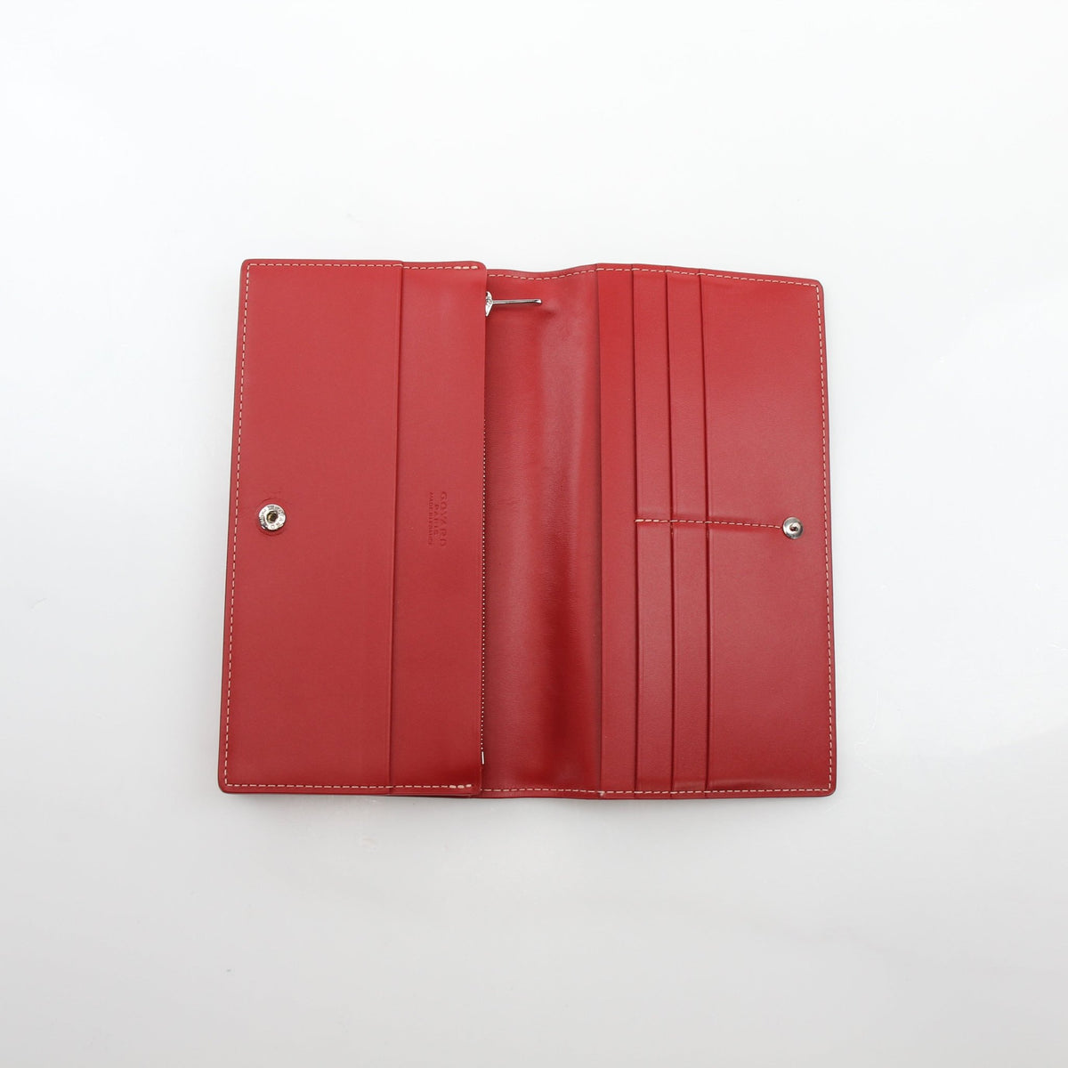 Red Goyard Varenne long flap wallet by Gold & Beyond with detailed Goyard pattern and gold-tone hardware.