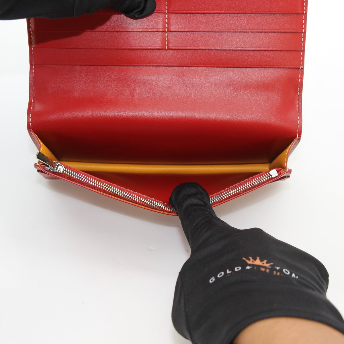 Goyard Varenne Long Flap Wallet in red with gold accents, featuring signature pattern and multiple card slots.