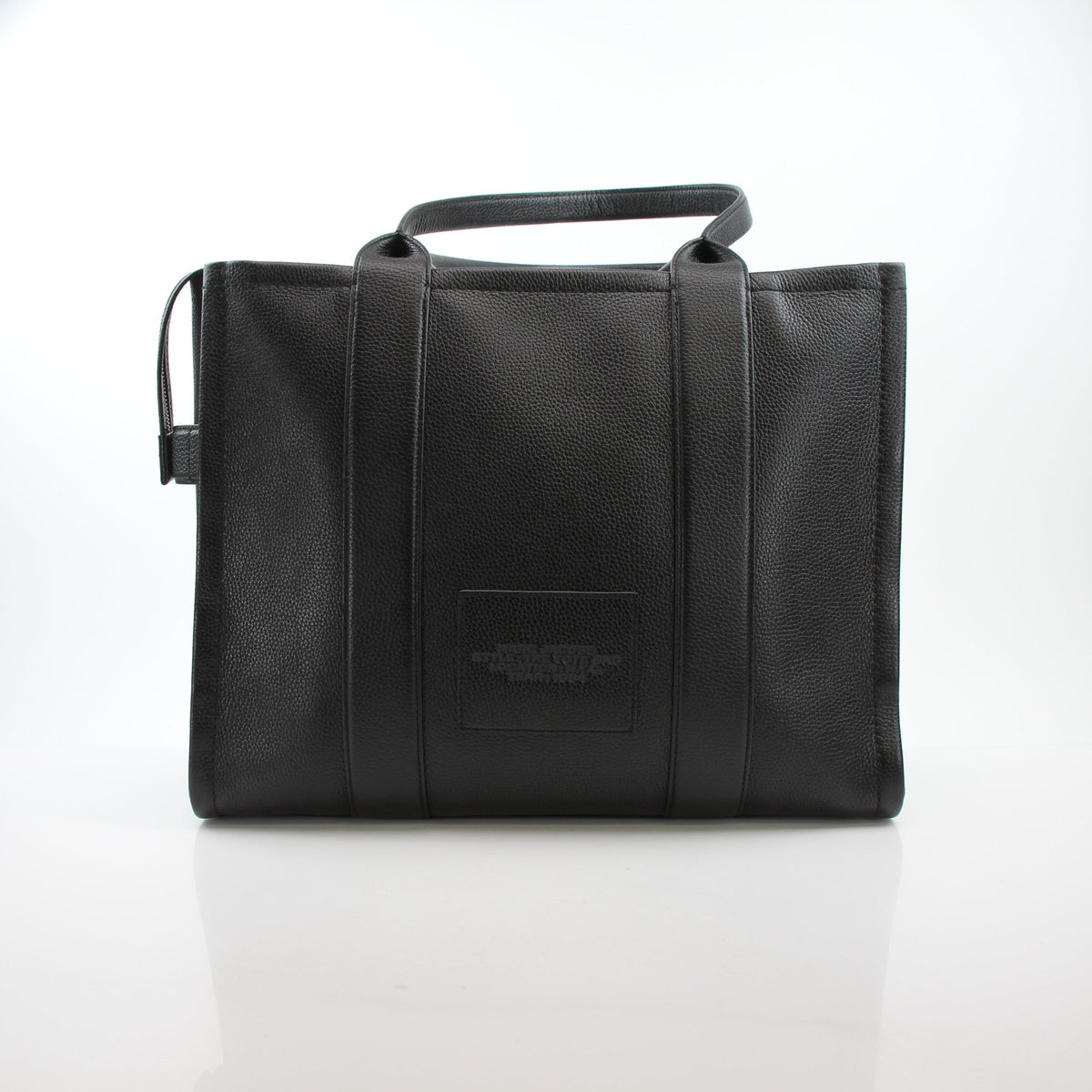 Black Marc Jacobs leather large tote bag with structured design, featuring dual handles and spacious interior.