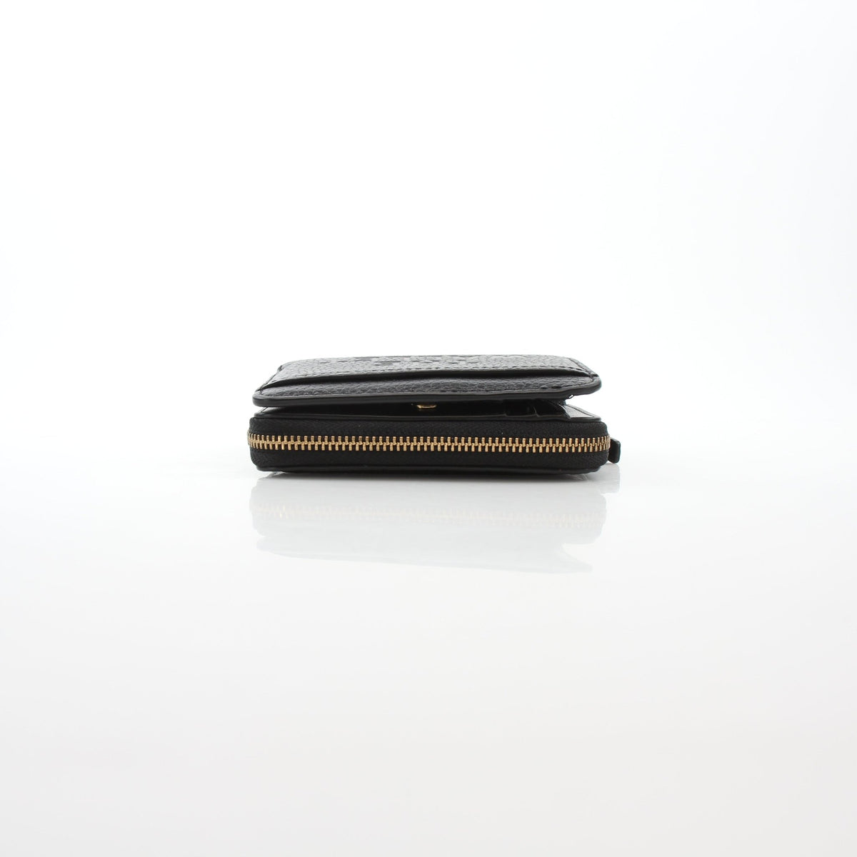 Black Marc Jacobs The Leather Mini Compact Wallet with gold-tone accents and a sleek, compact design.
