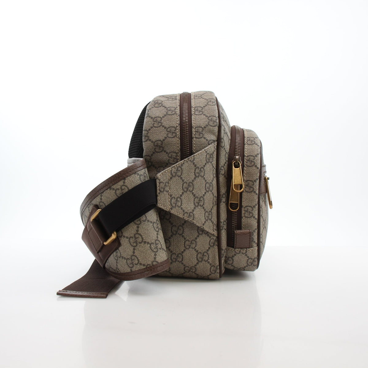 Beige and ebony Gucci Ophidia GG Supreme medium belt bag with adjustable strap and gold-tone hardware, stylish handbag accessory.