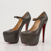 Christian Louboutin snakeskin platform heels with red sole, featuring sleek design and high stiletto heel.