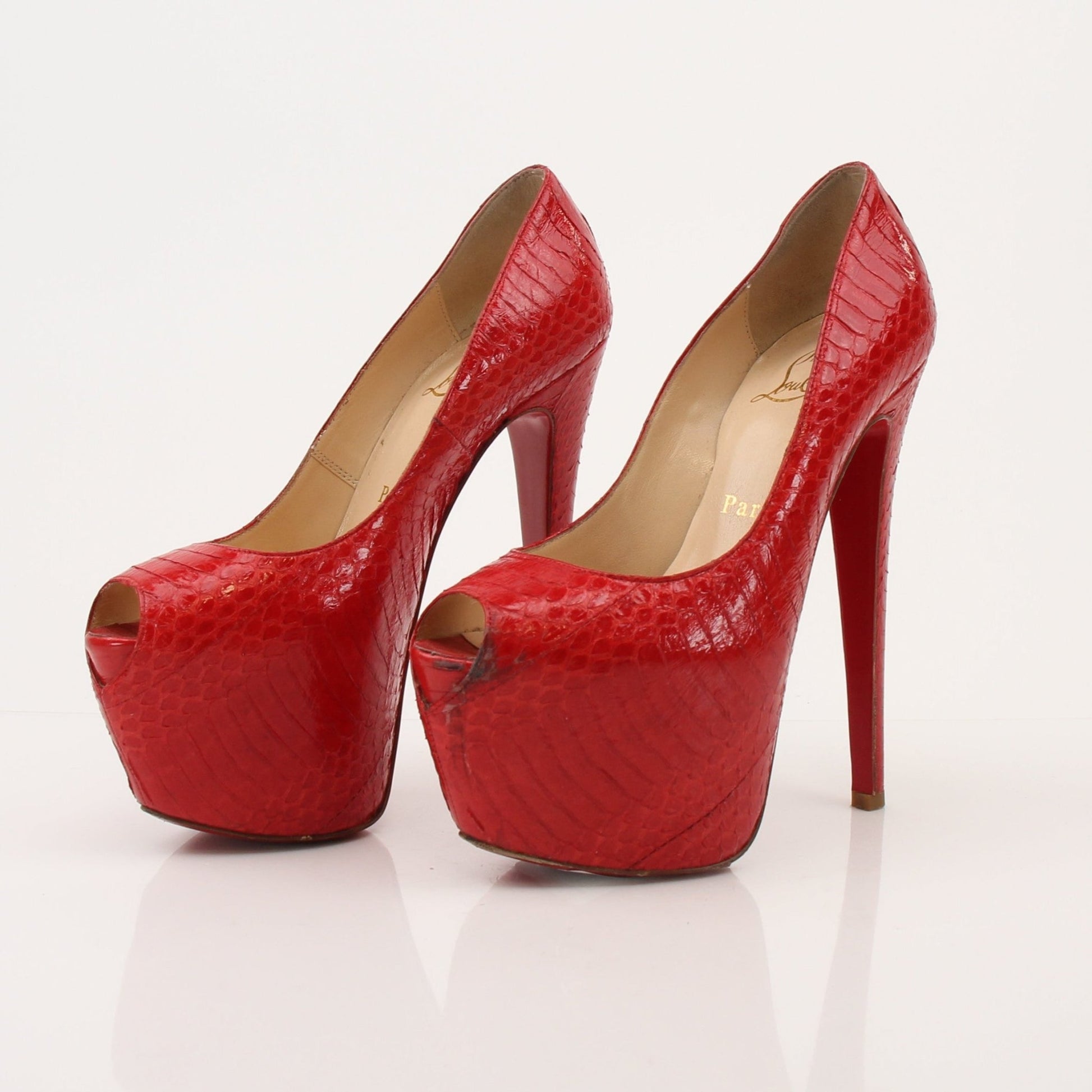 Gold & Beyond Christian Louboutin Lady Peep platform pumps featuring sleek heels and signature red soles.