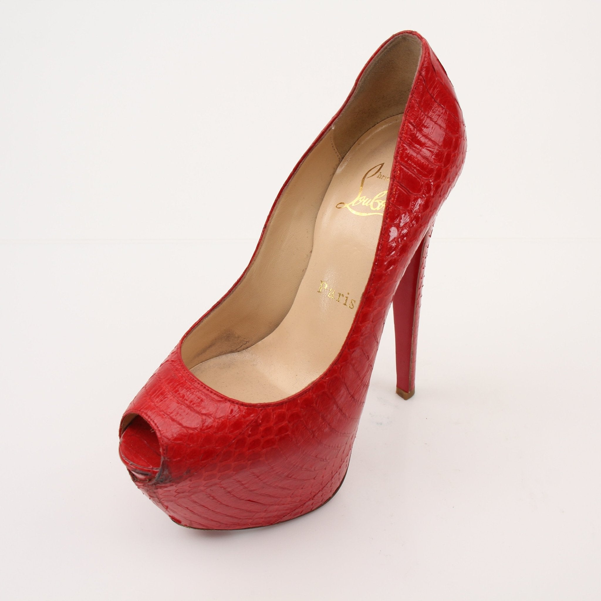 Christian Louboutin Lady Peep platform heels with signature red soles and sleek design, showcased on a neutral background.
