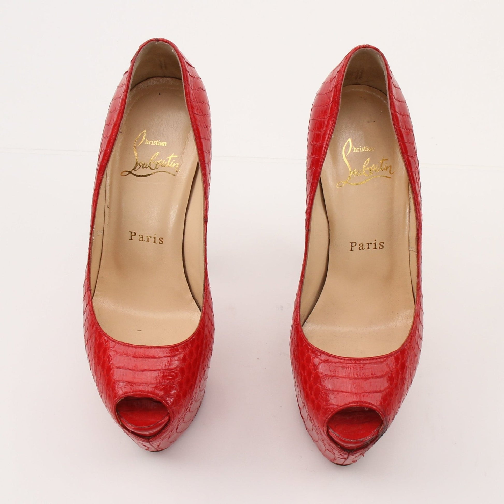 Christian Louboutin Lady Peep platform pumps with red soles, black heels, and stylish design, by Gold & Beyond.