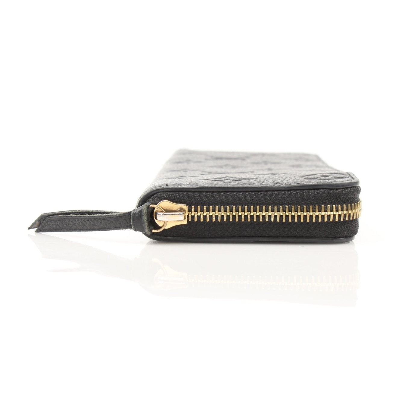 Louis Vuitton Clemence Empreinte wallet with gold-tone hardware and embossed leather, open to show multiple card slots and interior compartments.