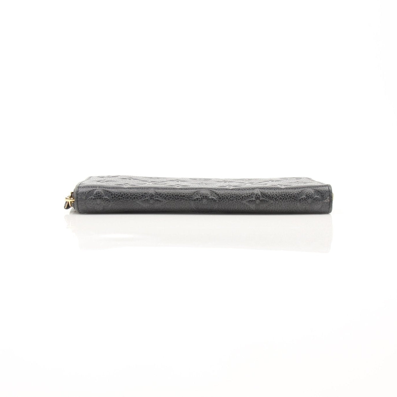Louis Vuitton Clemence Empreinte wallet with gold accents, featuring textured leather and multiple card slots.