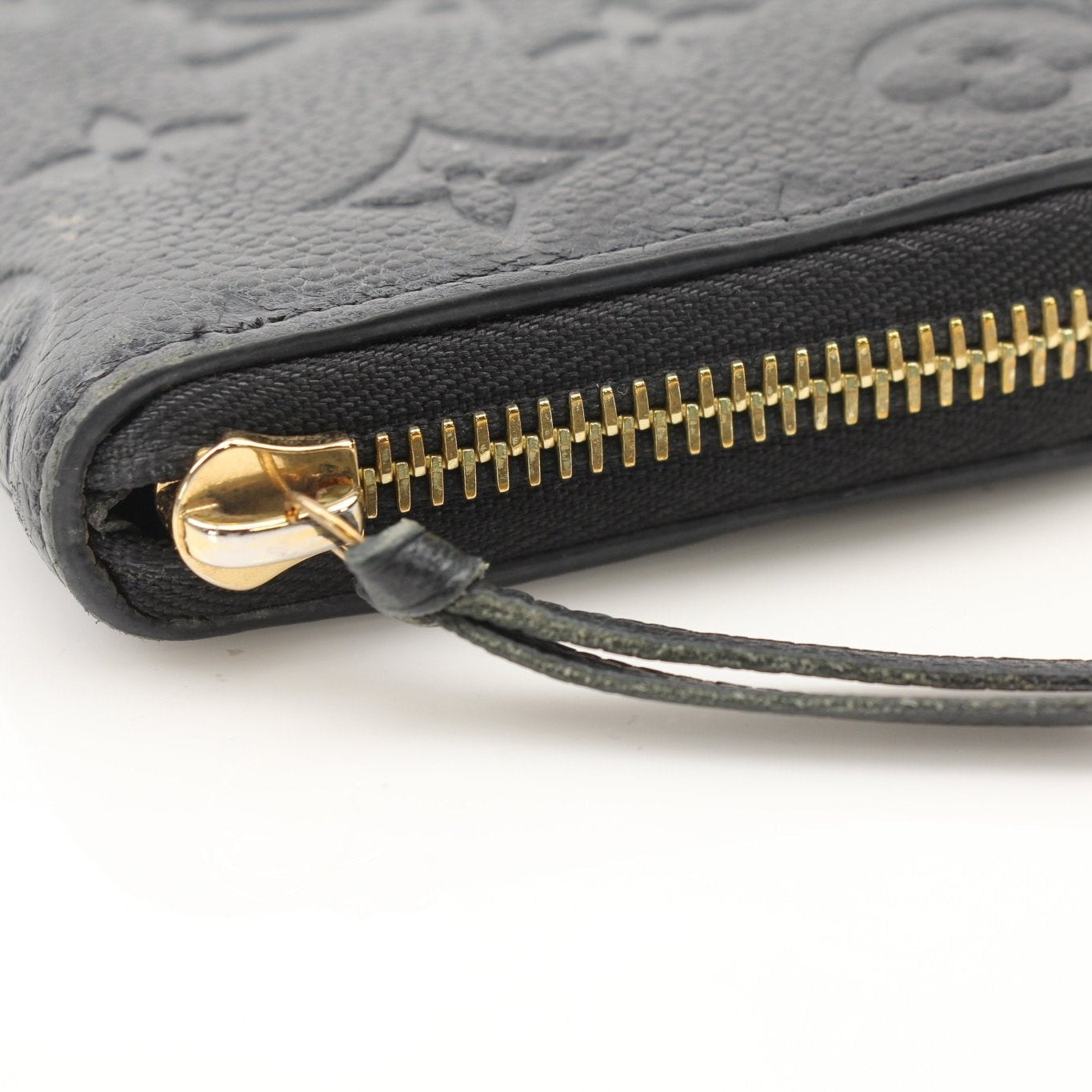Louis Vuitton Clemence Empreinte wallet by Gold & Beyond, showcasing textured leather and elegant design with multiple card slots.
