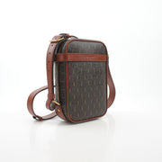 Brown Saint Laurent Le Monogramme crossbody pouch handbag with gold hardware and adjustable strap.