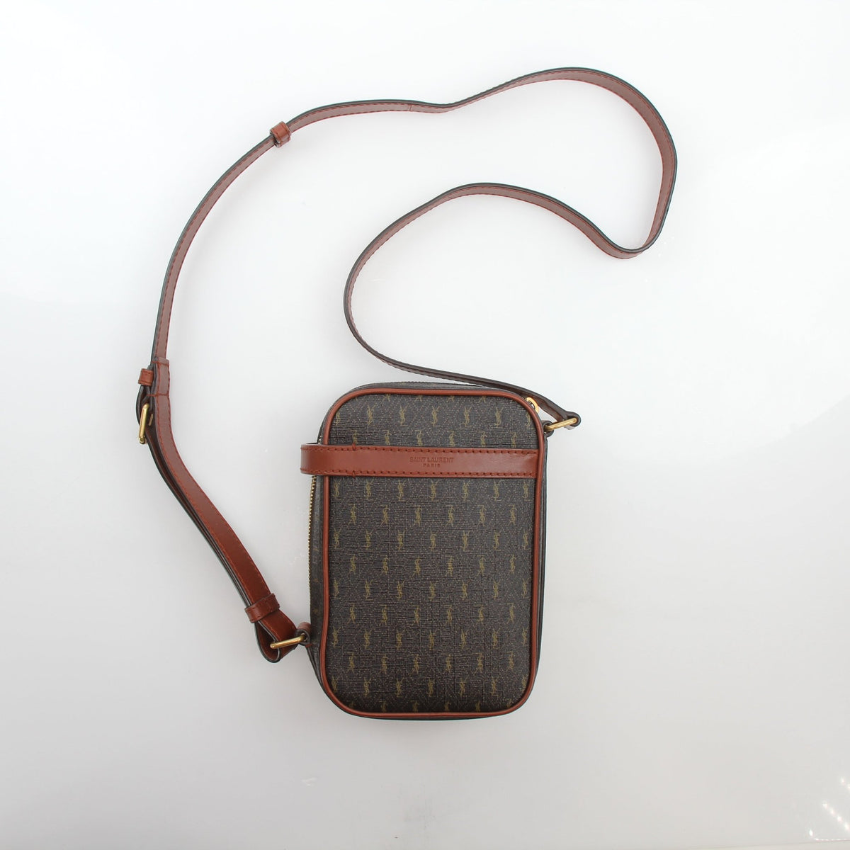 Brown Saint Laurent Le Monogramme Crossbody Pouch handbag with gold-tone hardware, featuring monogram logo and adjustable strap.