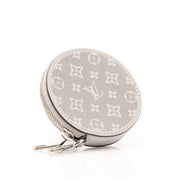 Gray Louis Vuitton round bag charm accessory with gold accents, designed to add a stylish touch to handbags.