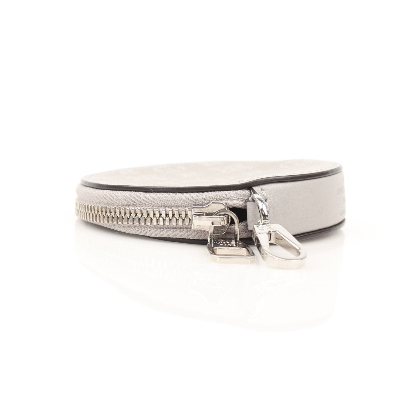 Louis Vuitton gray round bag charm accessory with gold accents, designed for stylish handbags and accessories.