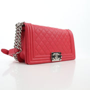 Red quilted caviar leather Chanel Boy handbag with chain strap and gold-tone hardware