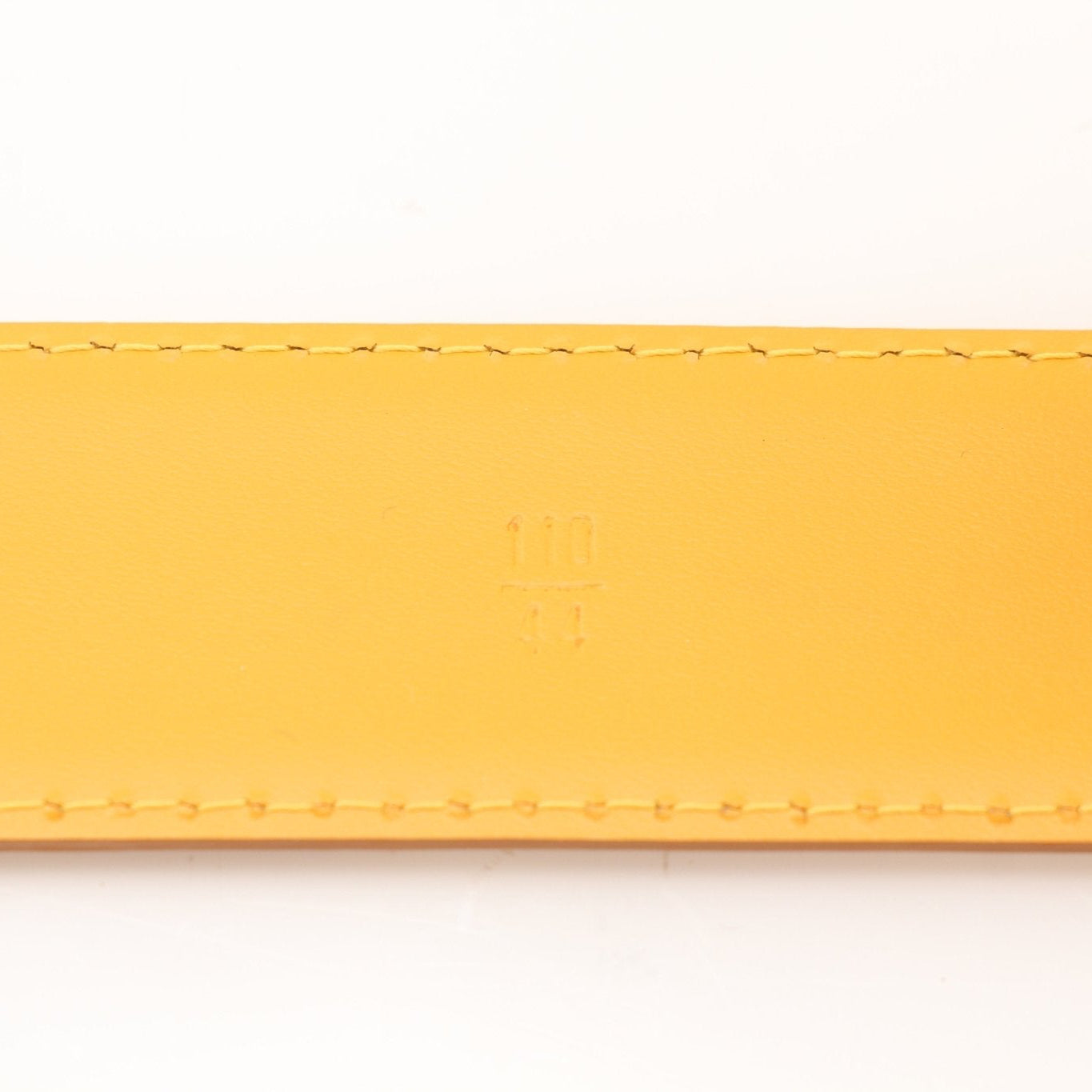 Louis Vuitton yellow belt from Gold & Beyond accessories collection, featuring a sleek design and adjustable buckle.
