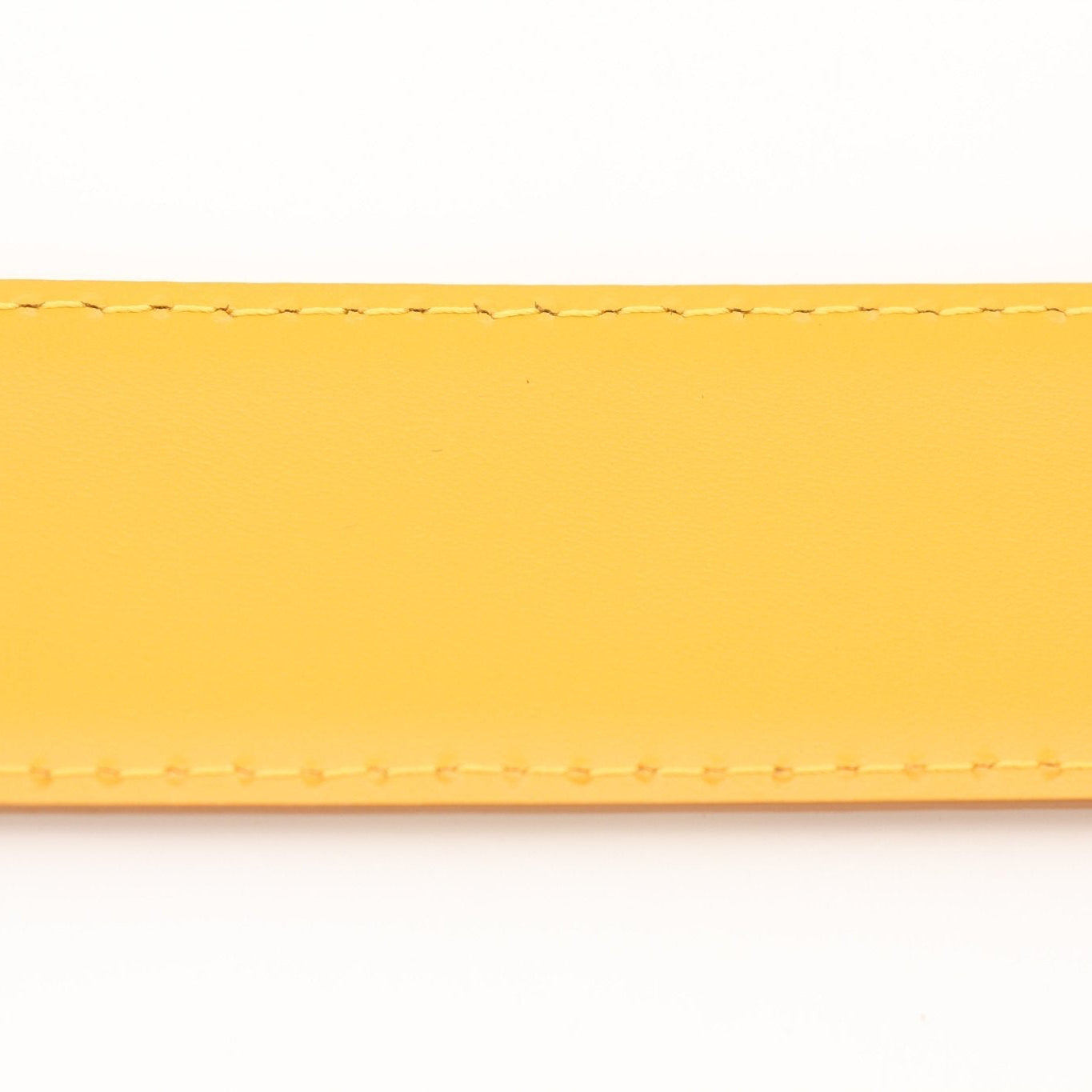 Louis Vuitton yellow belt from Gold & Beyond, featuring a stylish accessory with a sleek design and gold-tone buckle.