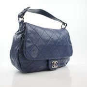 Blue glazed calfskin XL flap bag by Chanel, featuring a structured silhouette and signature quilted detailing