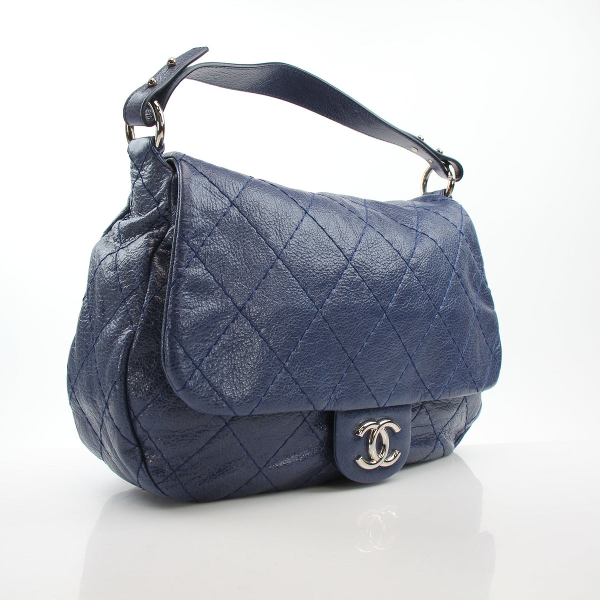Blue glazed calfskin XL flap bag by Chanel, featuring a structured silhouette and signature quilted detailing