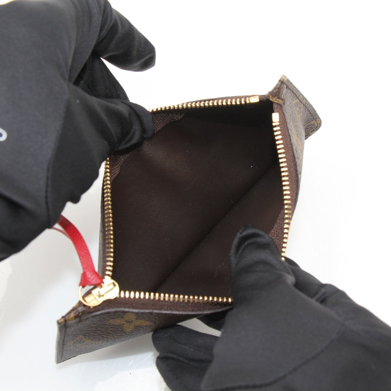 Louis Vuitton Félicie Pochette insert wallet with multiple card slots and gold-tone accents, shown on a neutral background.