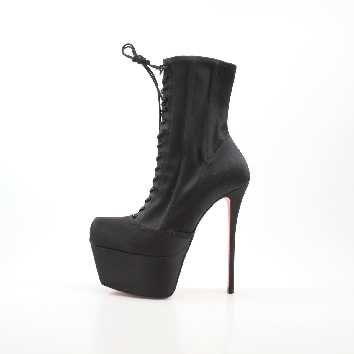 Christian Louboutin Pavlova Booty Alta black satin platform heels with high stiletto heels and sleek design.