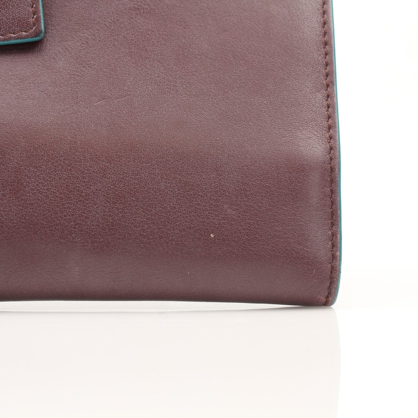 Fendi burgundy continental wallet by Gold & Beyond, featuring leather design with multiple card slots and a sleek, compact shape.