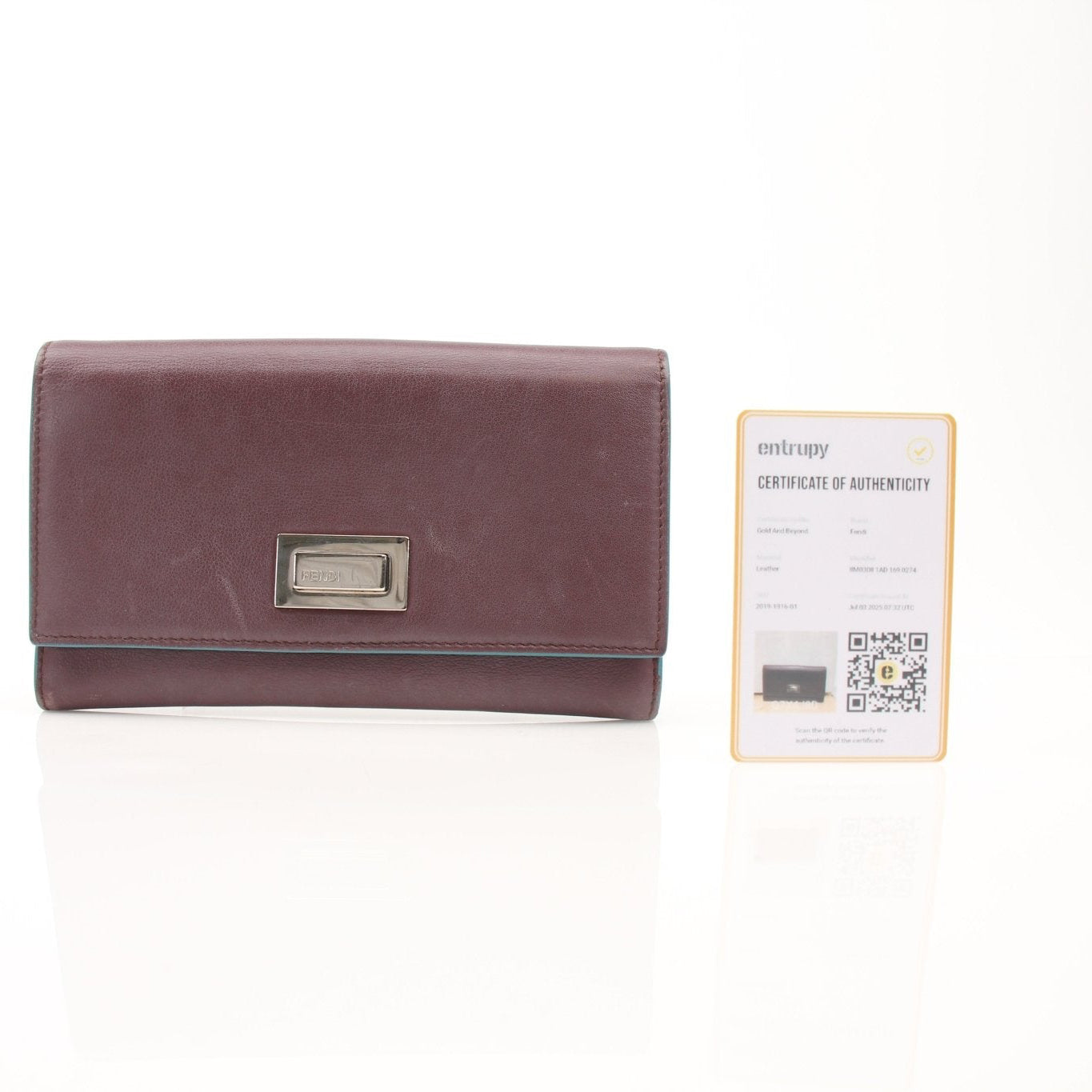 Fendi burgundy continental wallet with gold accents, featuring multiple card slots and a sleek, stylish design.