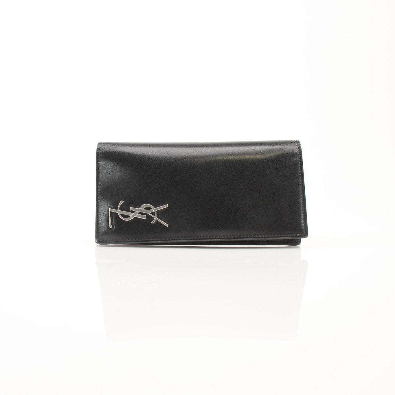 Black Saint Laurent Monogram YSL flap wallet with gold accents, showcasing sleek designer leather wallet with signature logo details.