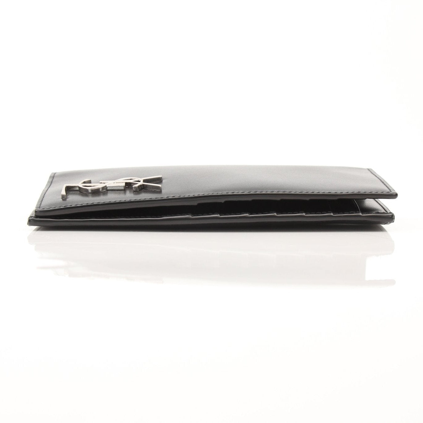 Black Saint Laurent Monogram YSL flap wallet with gold accents, featuring the iconic logo and sleek leather design.