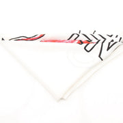 White silk Fendi “King Demon” scarf featuring intricate demon and crown designs, styled as a luxury accessory.