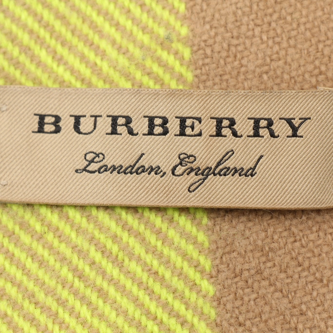 Gold & Beyond Burberry London Check Fringe Scarf with classic plaid pattern and fringed edges, stylish accessory for cold weather.